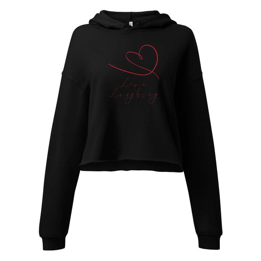 Front view of Love Laughing Women's Cropped Hoodie in black featuring red heart and script design. Ideal Valentine's gift made from eco-friendly fabric.