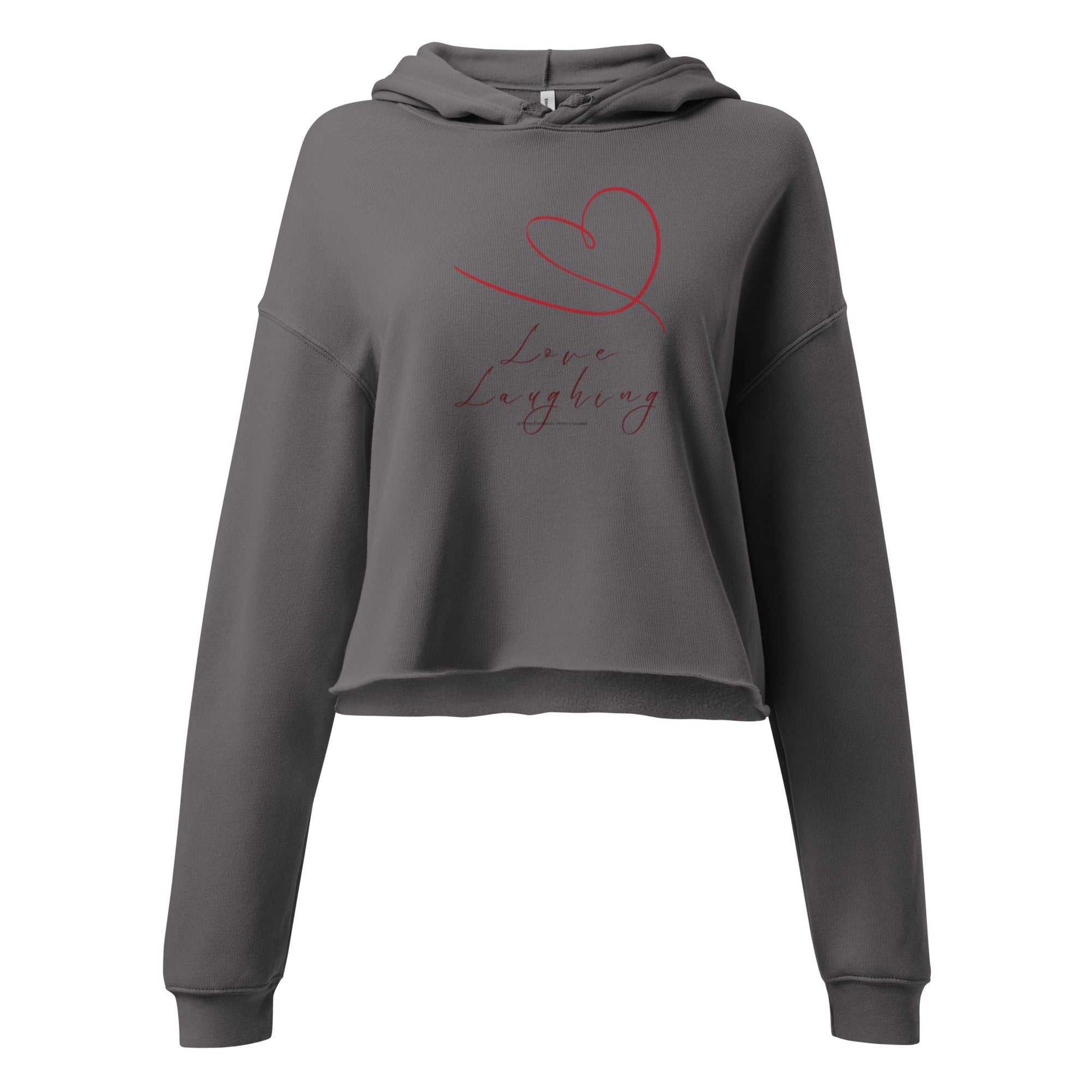Front view of charcoal Love Laughing Women's Cropped Hoodie with red heart and script. Eco-friendly Valentine's hoodie for casual wear.
