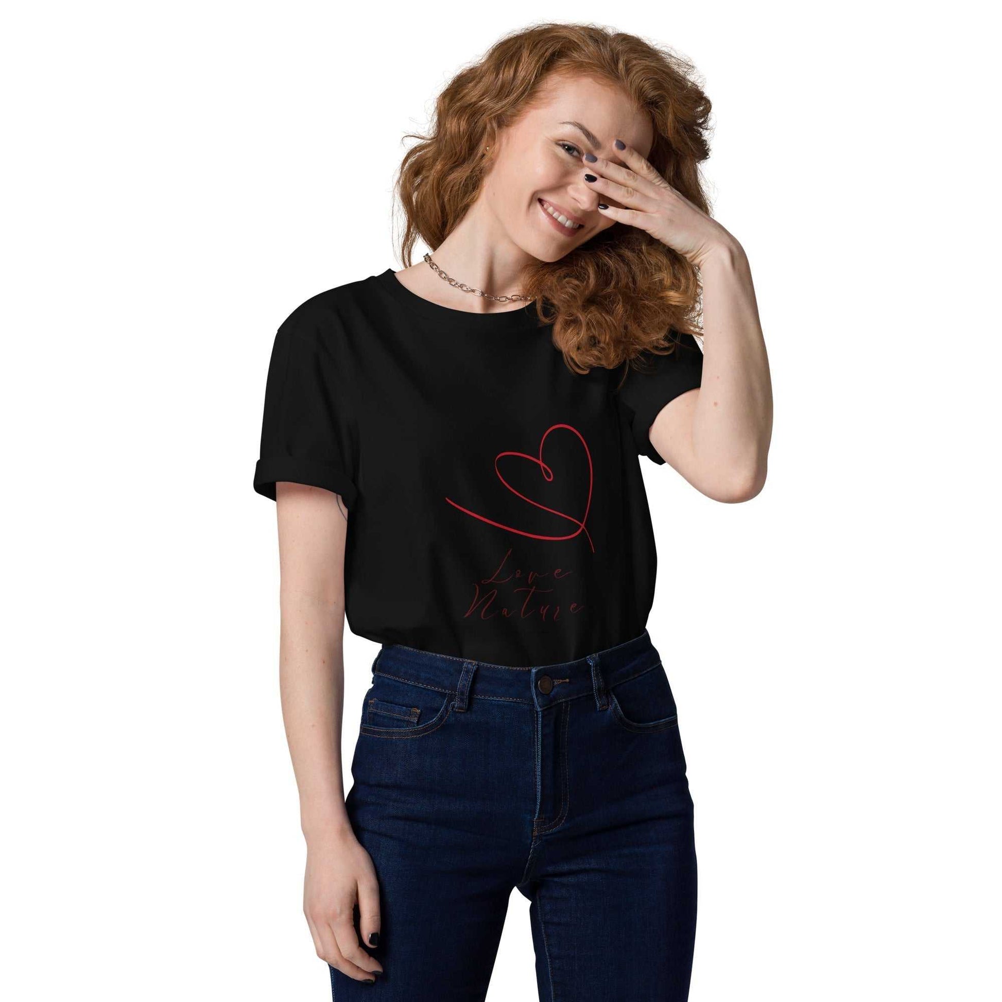 Black Love Nature unisex organic cotton t-shirt featuring red heart and script design, paired with dark jeans for sustainable fashion appeal.