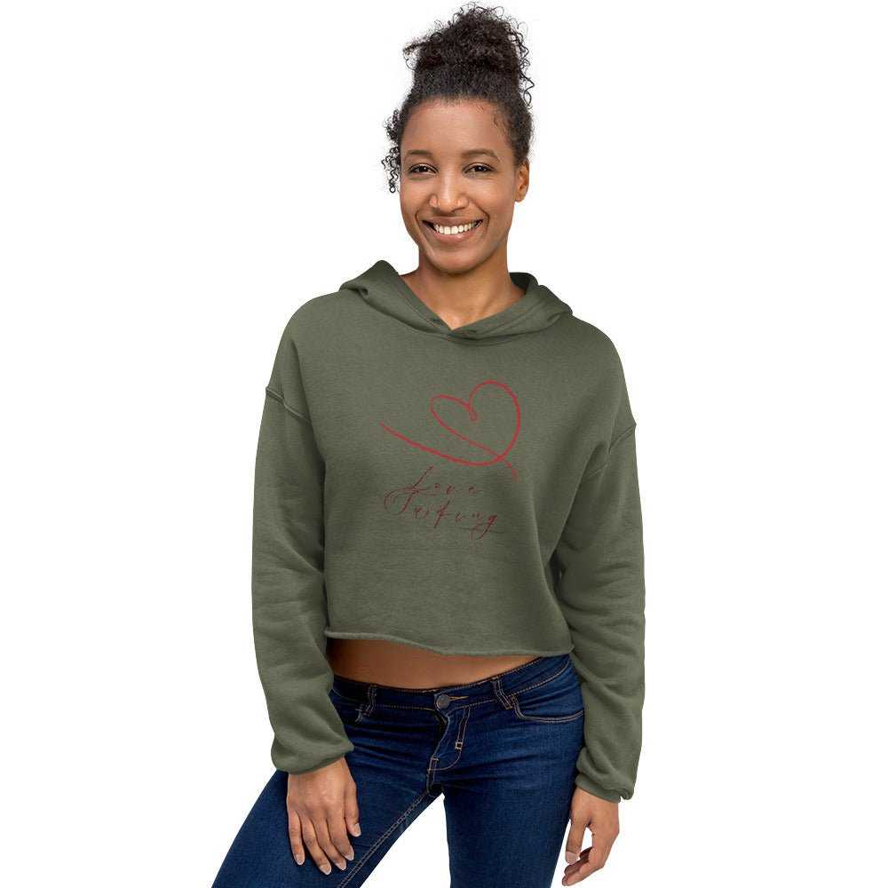 Model in olive green Love Surfing cropped hoodie with red heart design, perfect eco-friendly choice for casual layering.