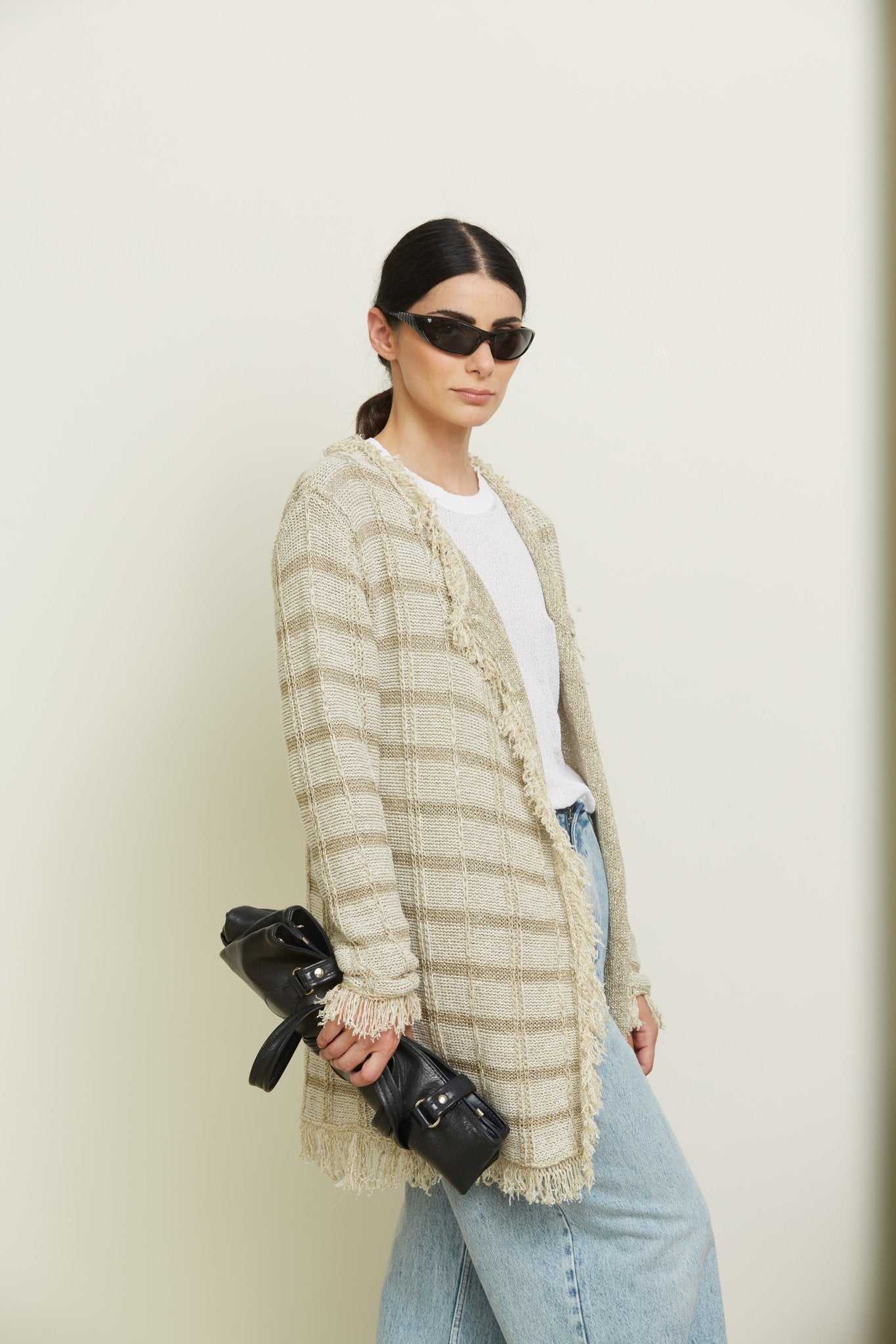 Close-up side view of Olivia Midi Cardigan with Lurex Inserts by Tenné, highlighting textured knit, subtle shimmer, and Italian craftsmanship.