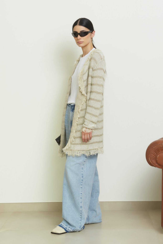 Olivia Midi Cardigan with Lurex Inserts by Tenné in beige tones, styled with wide-leg jeans and white top, featuring fringed edges and shimmer.