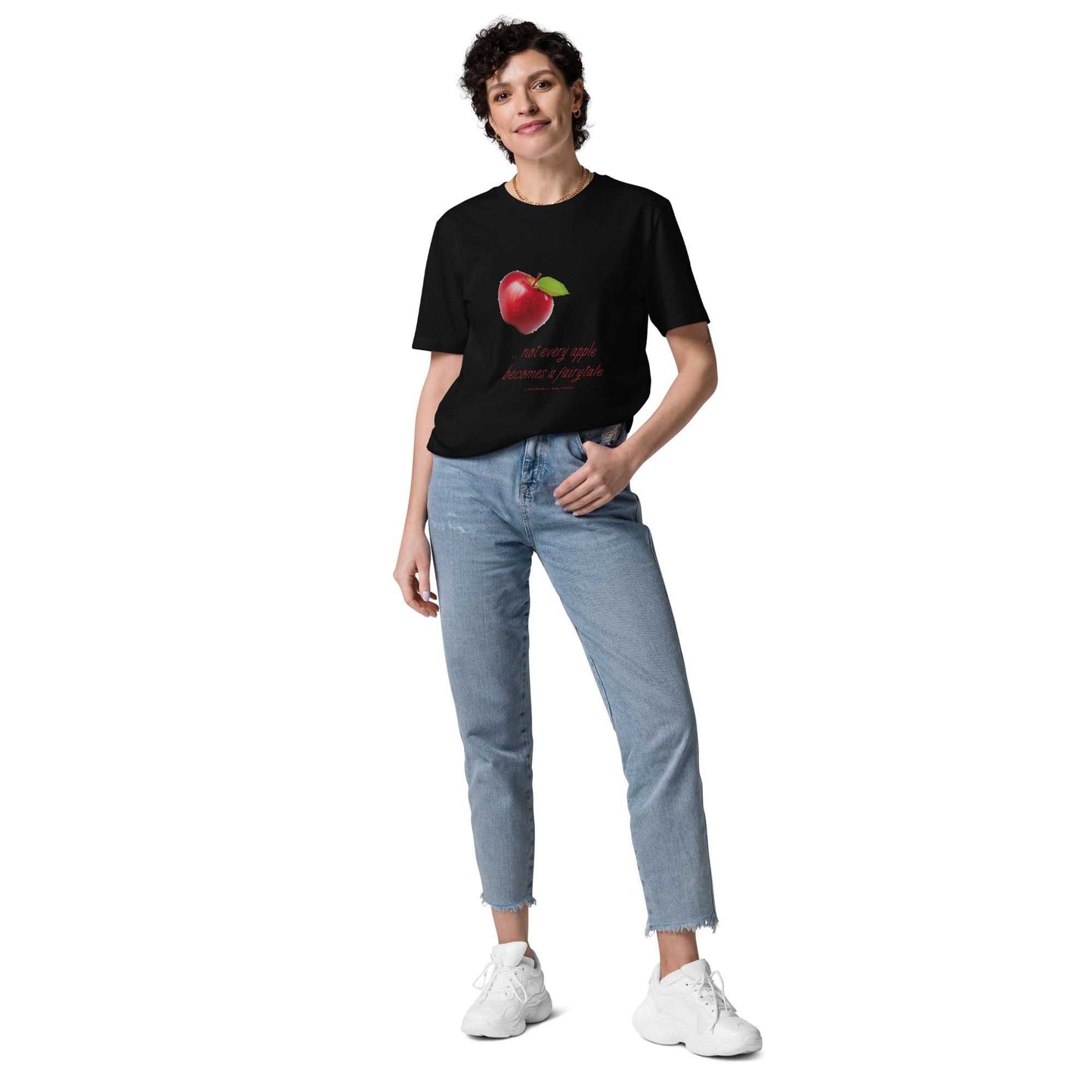 Black unisex organic cotton t-shirt with red apple and 'Not every apple becomes a fairytale' text. Eco-friendly and humorous design.