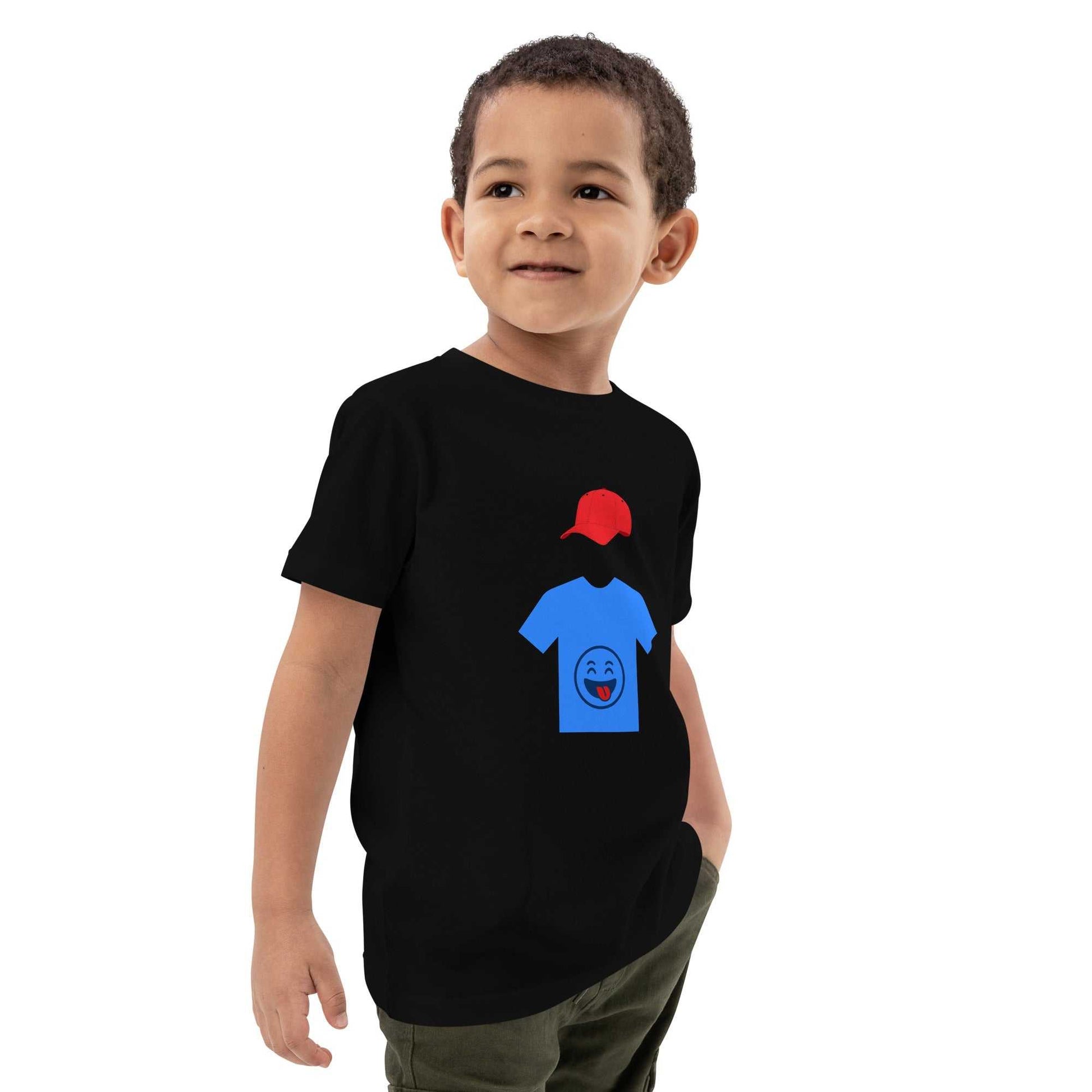 Black organic cotton kids t-shirt with blue shirt and red cap graphic, modeled by child, perfect for playful and eco-conscious outfits.