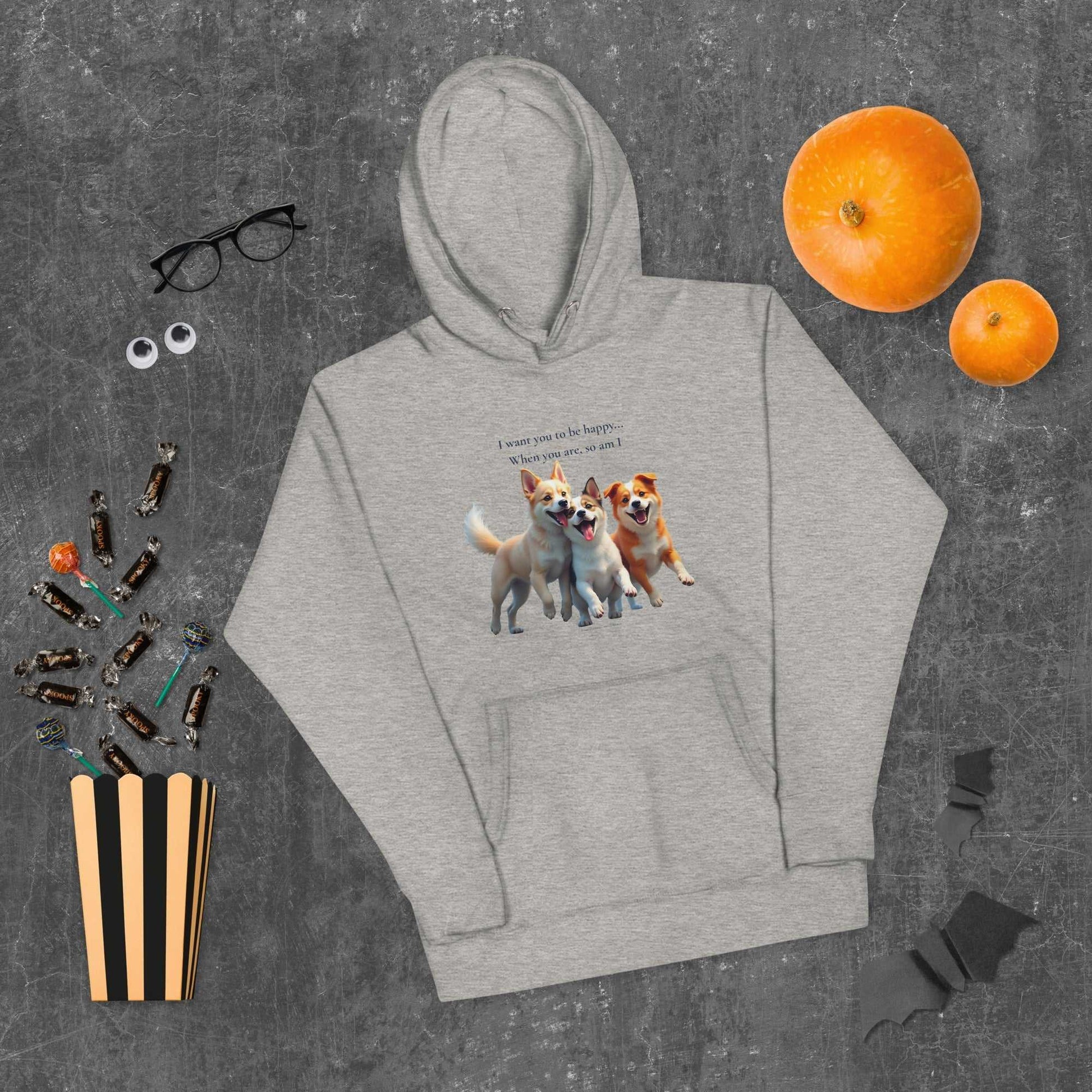 Gray unisex hoodie for comfort with dog print, styled flat with Halloween decor, perfect for festive and casual wear.