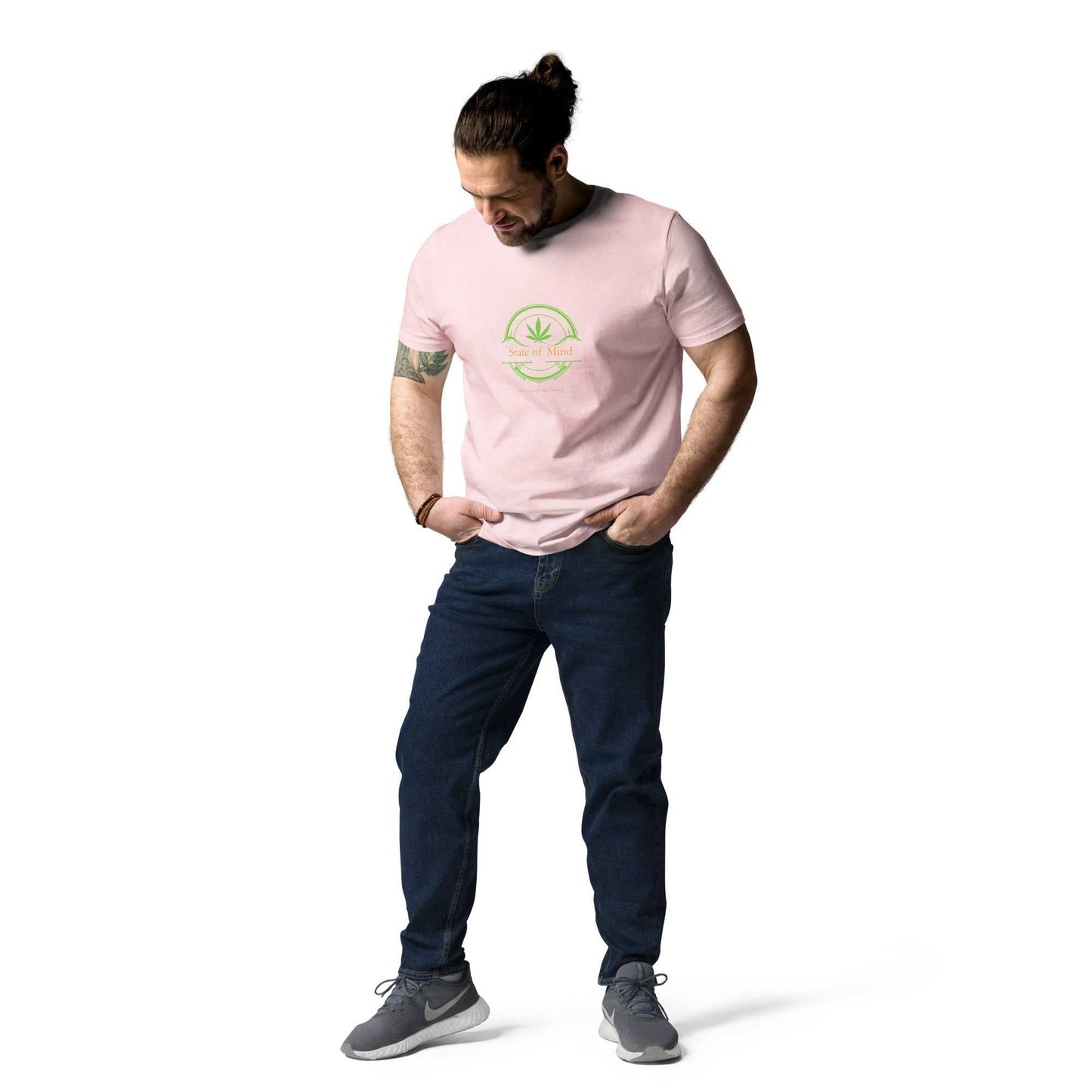 Light pink State of Mind organic cotton unisex t-shirt styled casually. Fresh green emblem adds a playful touch to sustainable fashion.