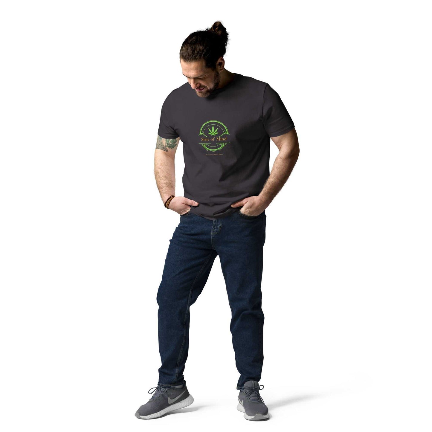Charcoal State of Mind organic cotton unisex t-shirt styled with casual jeans. Fresh green emblem for a sustainable fashion statement.