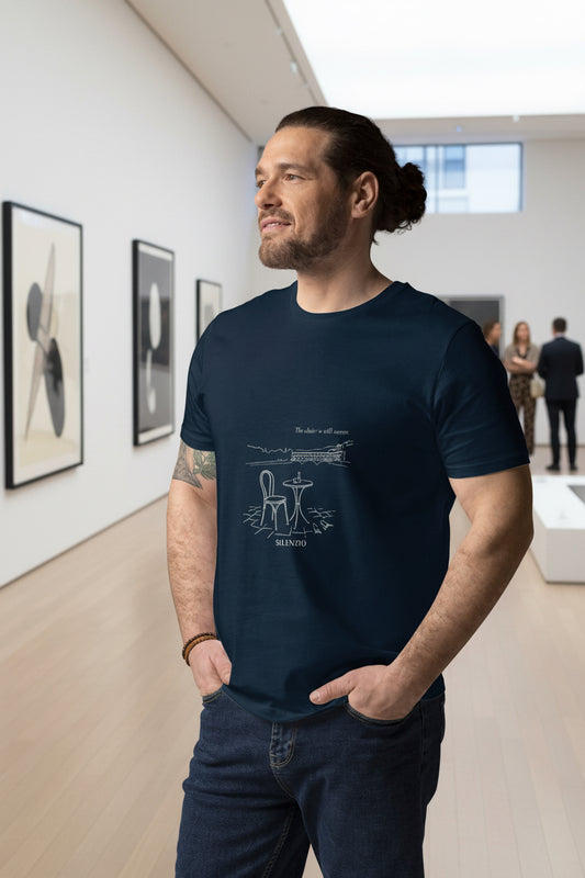 male wearing a dark blue t-shirt with line art depicting a view of Florence