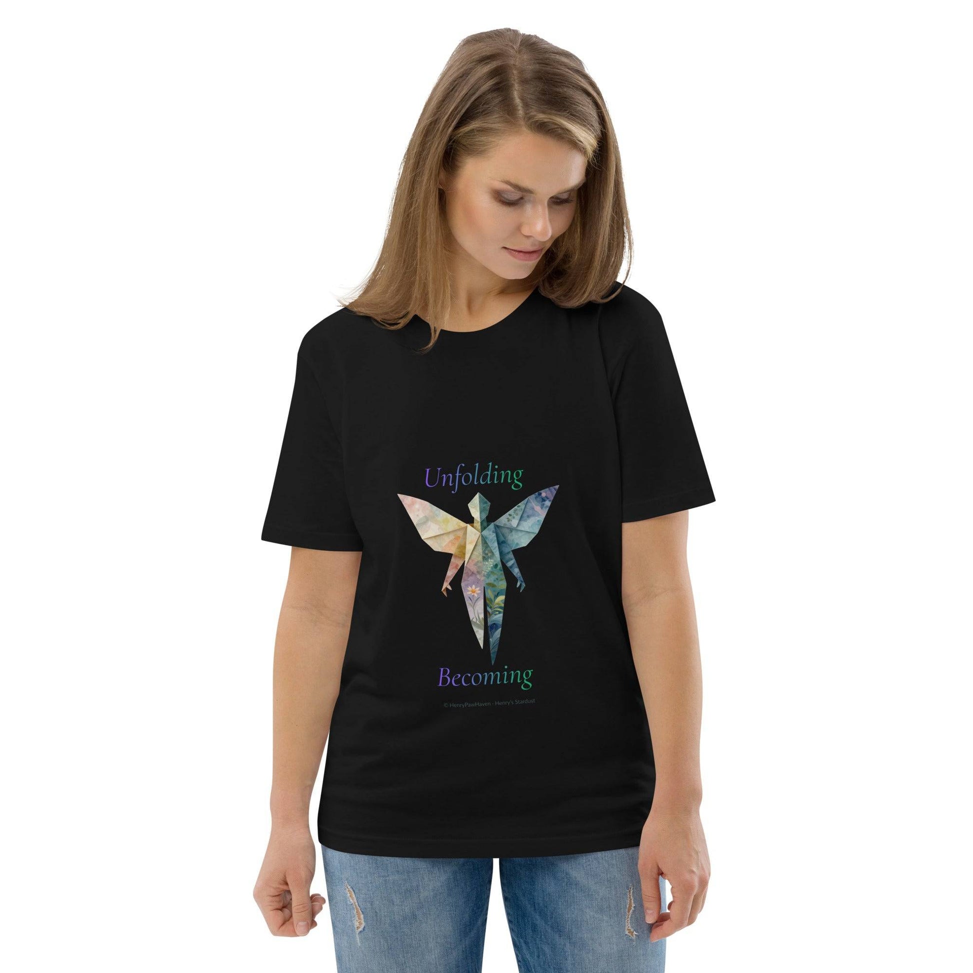 Black BOMBY Unfolding origamis silhouette Organic Cotton T-Shirt featuring colorful origami butterfly and 'Unfolding Becoming' text.