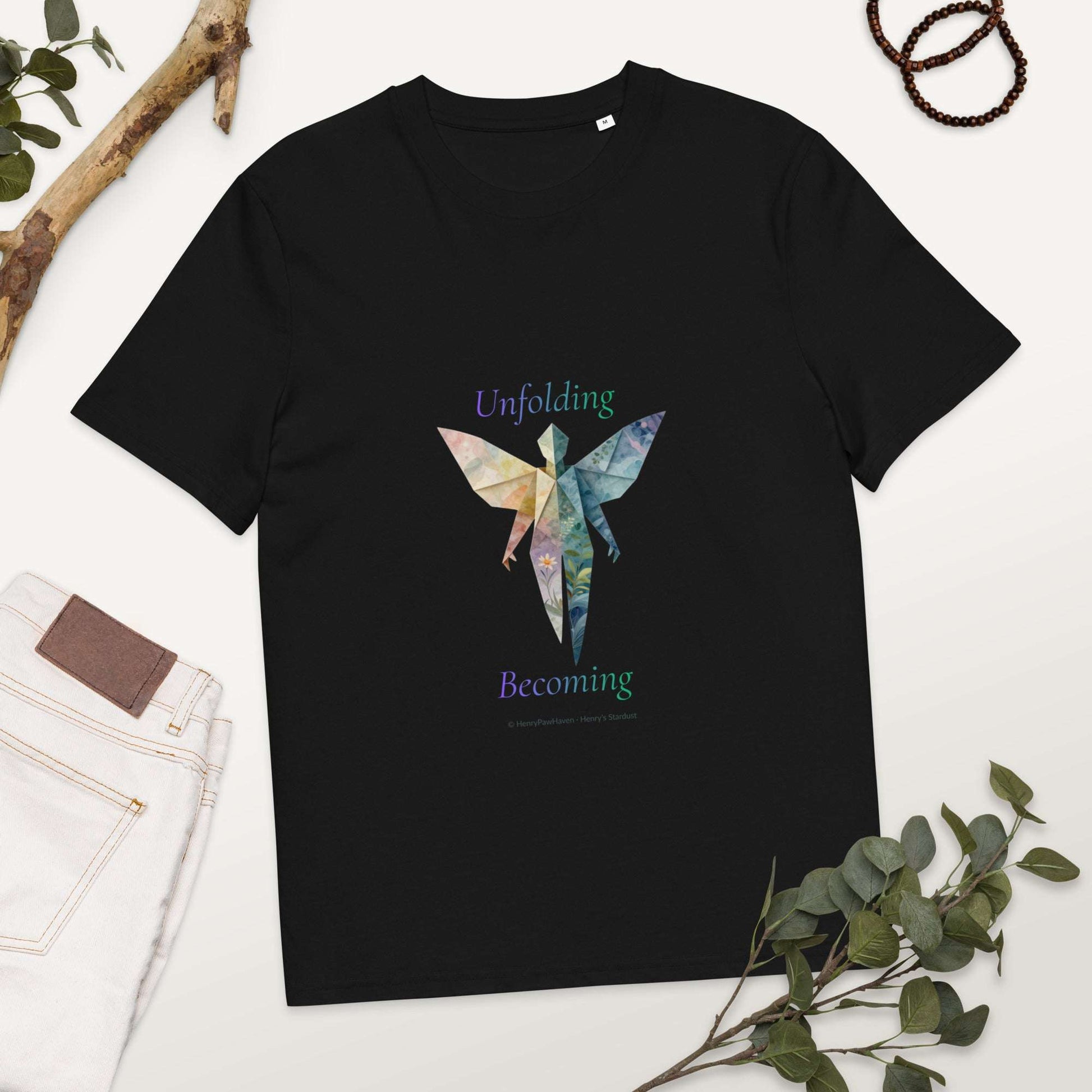 BOMBY Unfolding origamis silhouette Organic Cotton T-Shirt in black with butterfly-winged figure symbolizing transformation and growth.