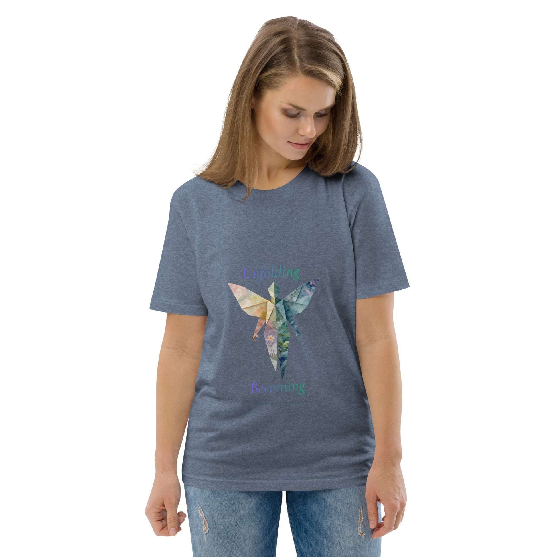 BOMBY Unfolding origamis silhouette Organic Cotton T-Shirt in heather blue with artistic butterfly-winged origami print and 'Unfolding Becoming' slogan.