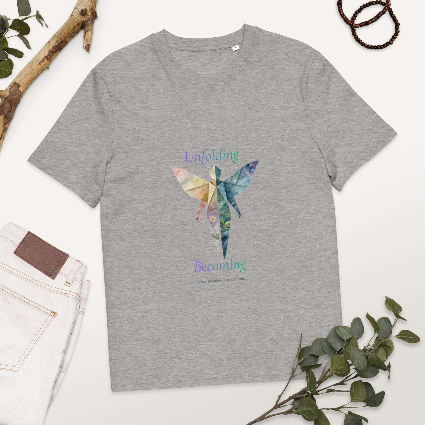 BOMBY Unfolding origamis silhouette Organic Cotton T-Shirt in grey with butterfly-winged figure symbolizing transformation and growth.
