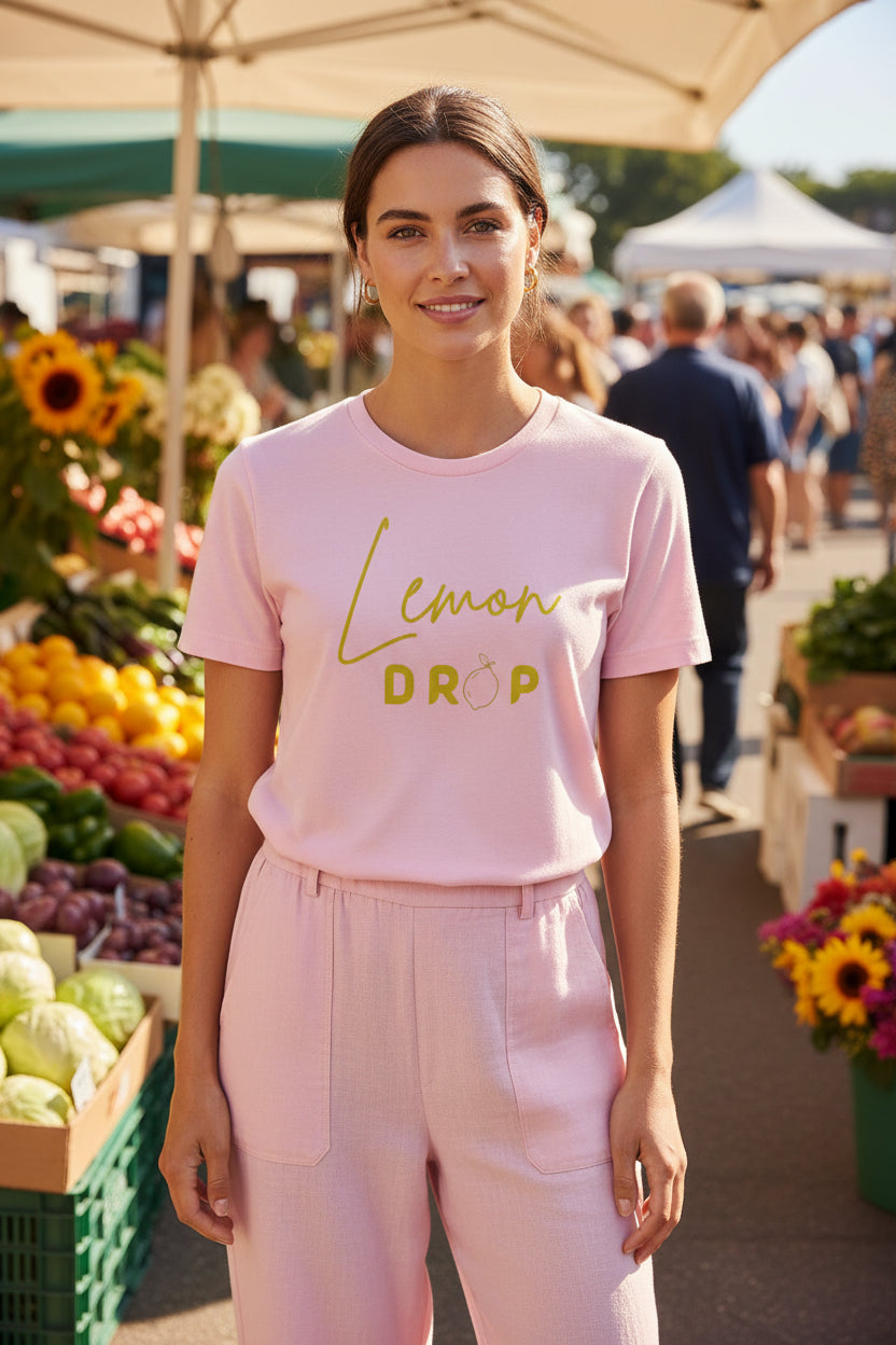 Pink t-shirt with 'Lemon Drop' text on a white background