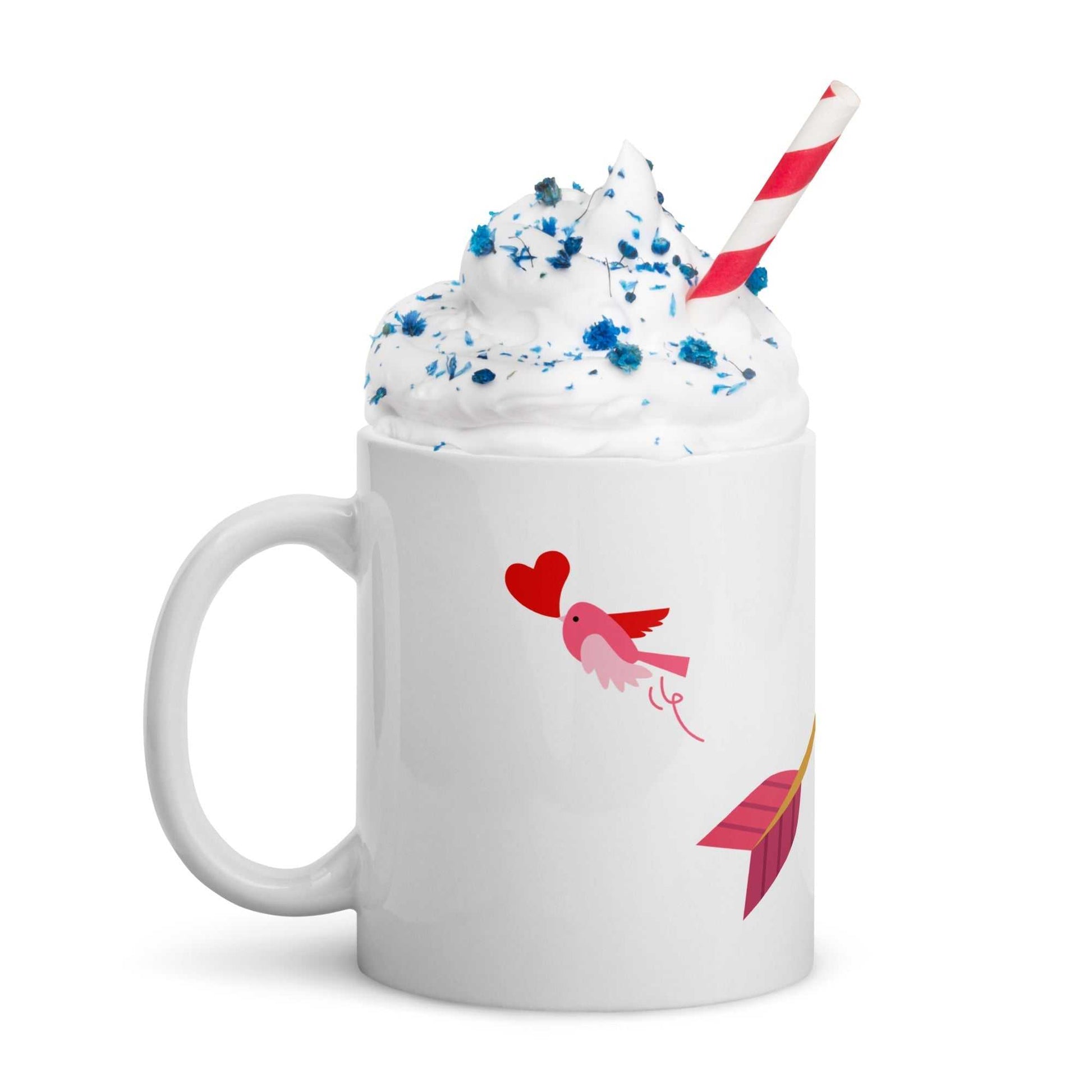 Valentine mug gift filled with whipped cream and straw, featuring pink bird and heart arrow design, festive drinkware.