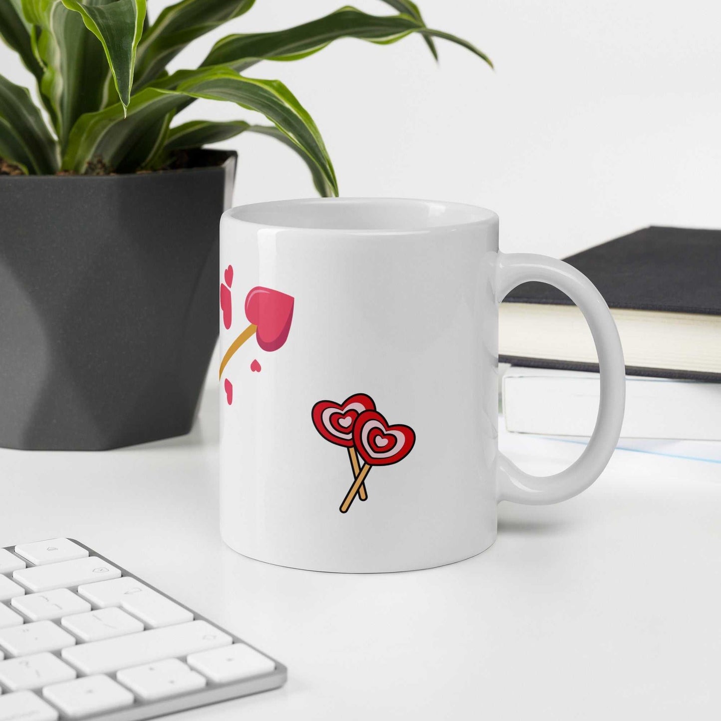 Valentine mug gift with heart lollipops and arrow design on office desk, perfect romantic drinkware for workspaces.