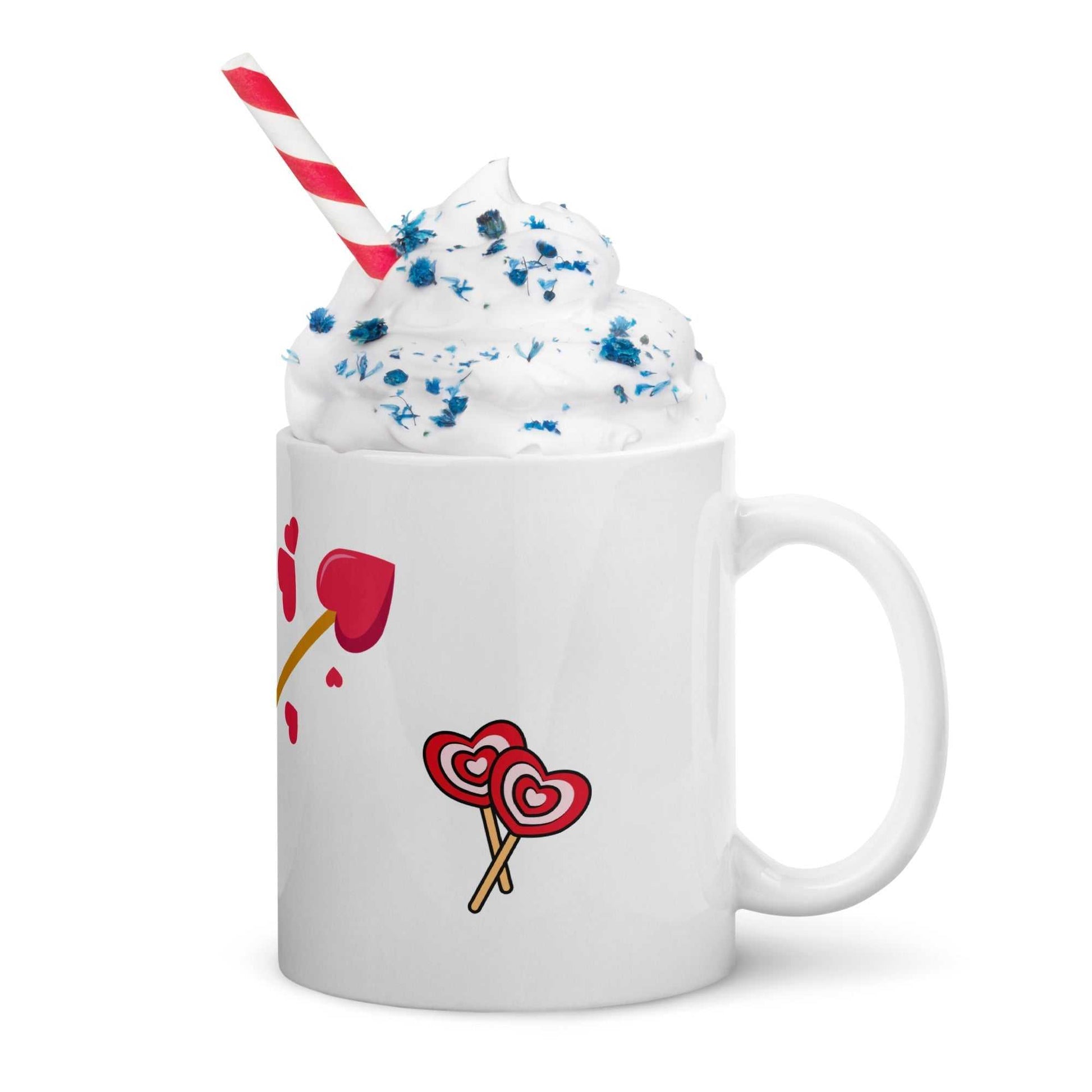 Valentine mug gift with whipped cream and straw, decorated with heart lollipops and arrow, ideal for romantic treats.