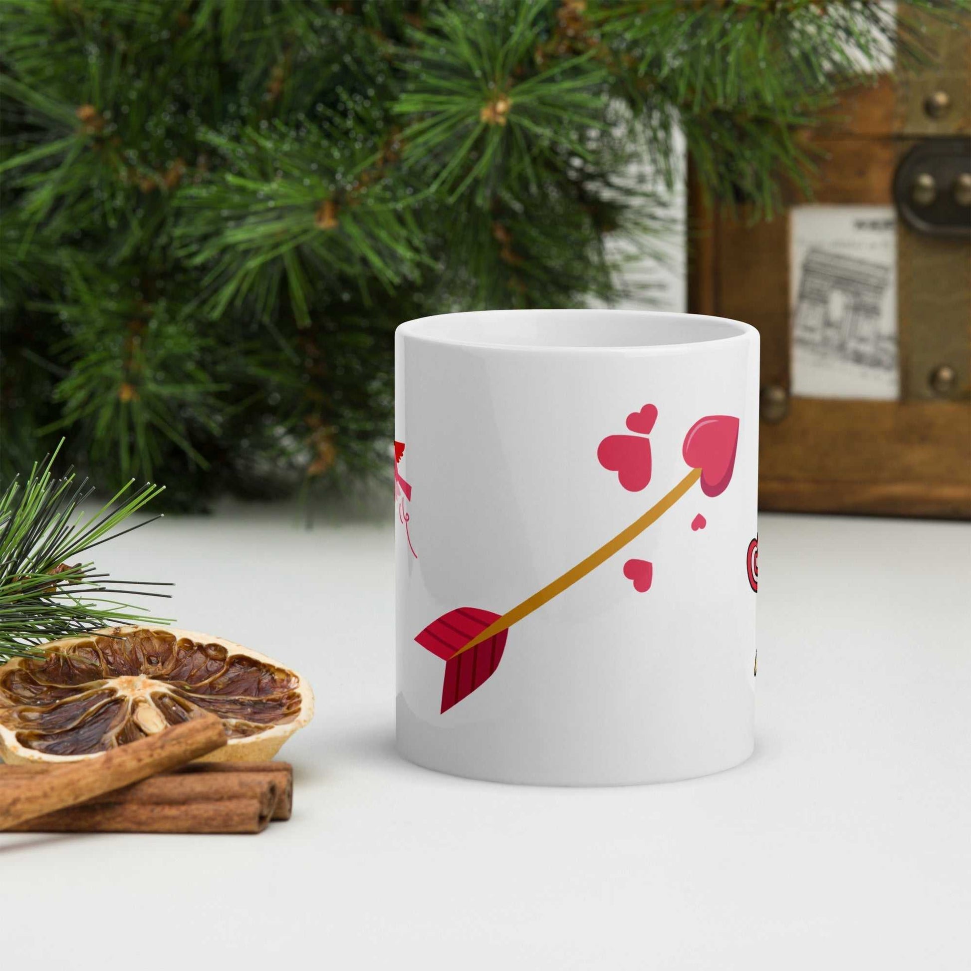 Close-up of Valentine mug gift showing red heart arrow design, perfect for romantic coffee moments or gifting.