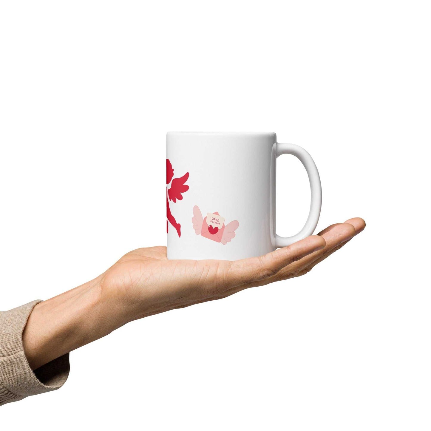 Hand holding Valentine Mug - Cupid & Butterfly gift with pink butterfly and love letter. 11 oz ceramic mug for romantic kitchen and dining use.