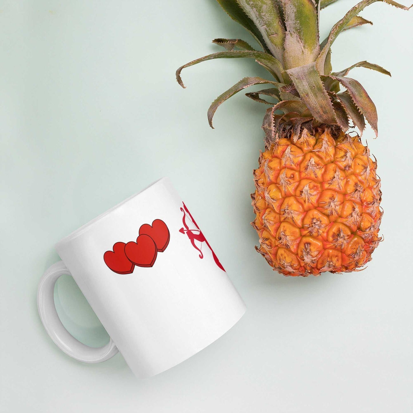 Valentine Mug - Cupid & Butterfly with red hearts, ceramic 11 oz mug styled with pineapple for a fun romantic gift idea.