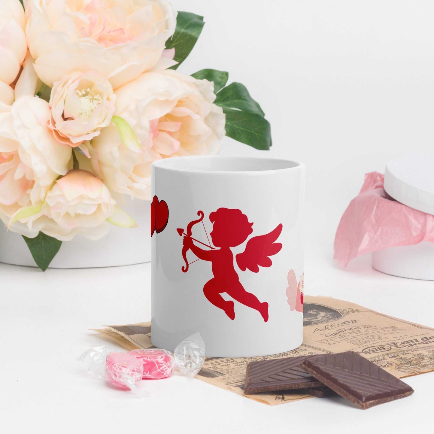 Valentine Mug - Cupid & Butterfly gift with red cupid and heart design, ideal for romantic coffee moments. Ceramic 11 oz mug on floral background.