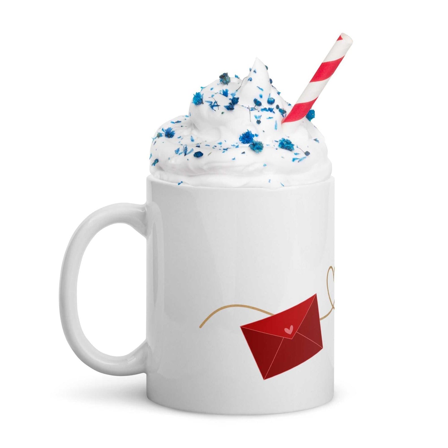 Ceramic valentine mug with red envelope design, filled with whipped cream and sprinkles, ideal for festive gifting.