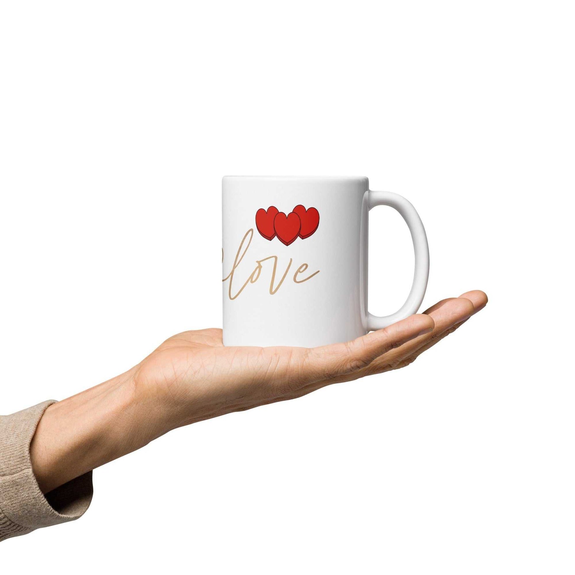 Hand holding valentine mug with red hearts and 'love' text, ceramic and dishwasher safe, ideal for gifting and daily use.