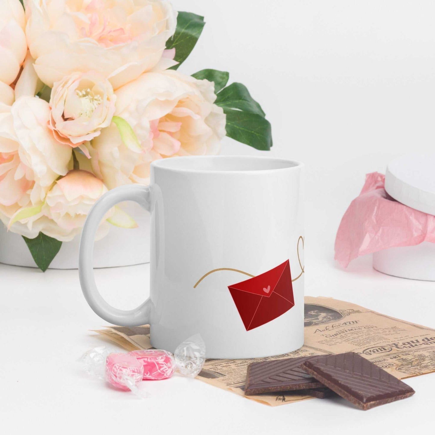 Valentine Mug - Envelope & Hearts gift beside flowers and chocolates, ceramic 11 oz, red envelope design, ideal for Valentine's Day.