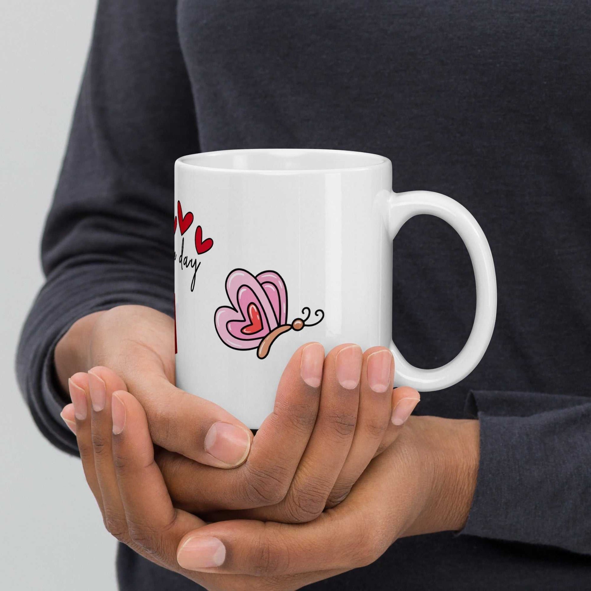 Valentine Mug - Ceramic Hearts Gift with butterfly and hearts, held in hands, perfect for cozy and heartfelt moments.