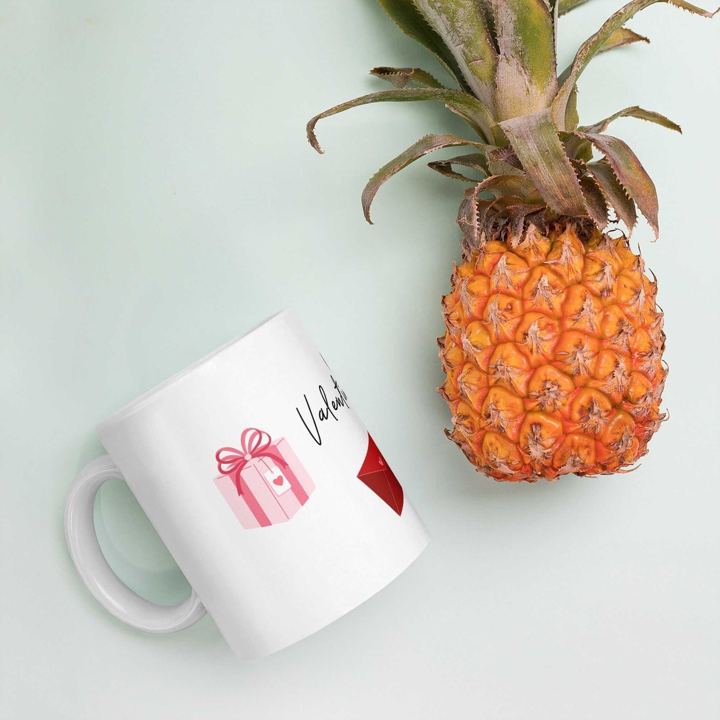 Valentine Mug - Ceramic Hearts Gift with pink present and red envelope, styled beside a pineapple for a fun tropical vibe.
