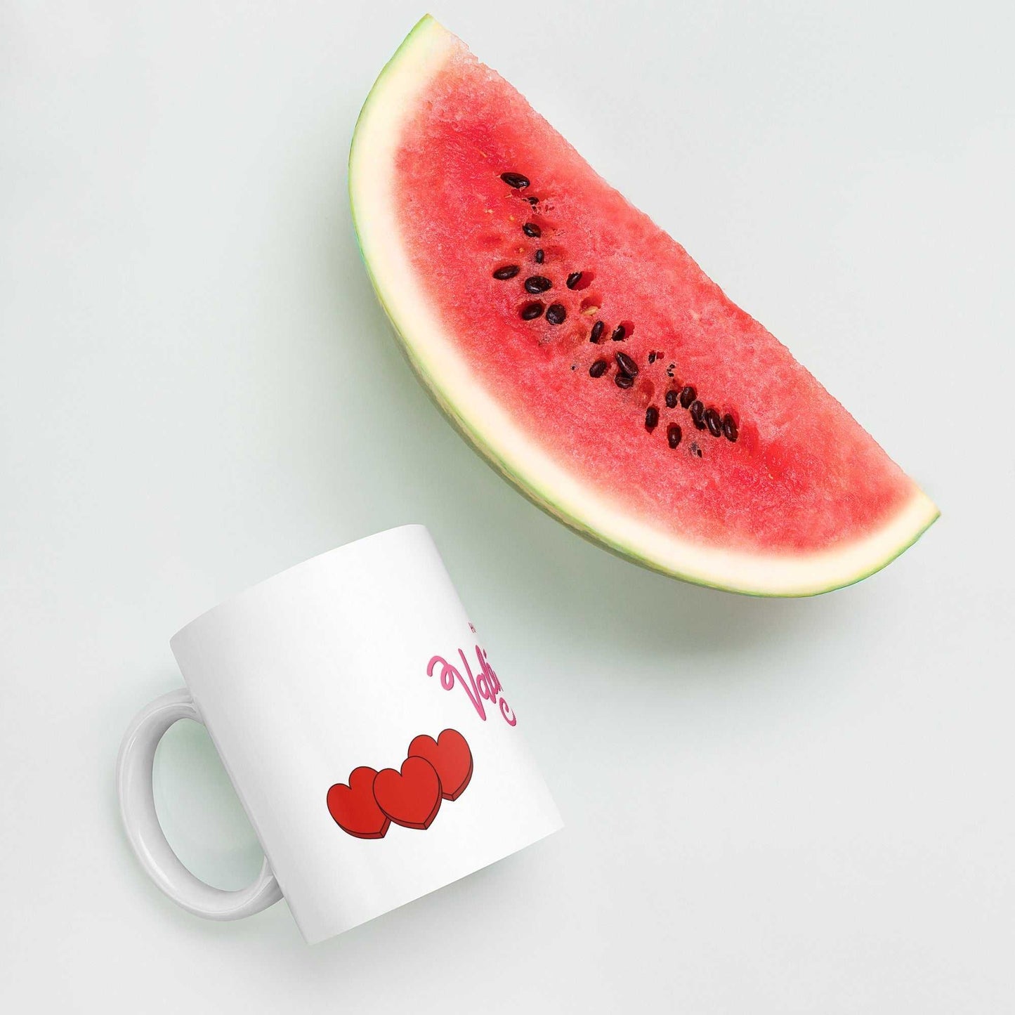Valentine Mug - valentine mug | 11oz ceramic drinkware with red hearts, styled next to watermelon slice, vibrant and playful gift.