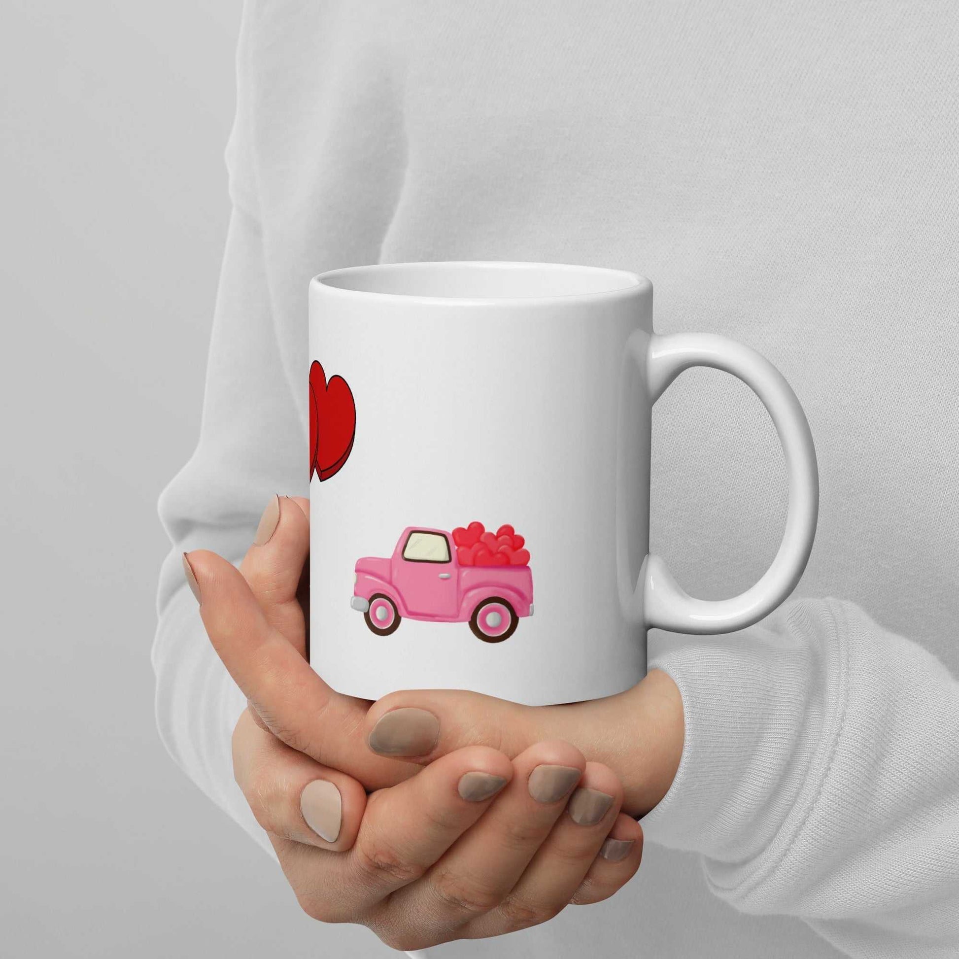 11 oz ceramic Valentine mug featuring a pink truck with hearts, ideal for romantic gifts or daily coffee use.
