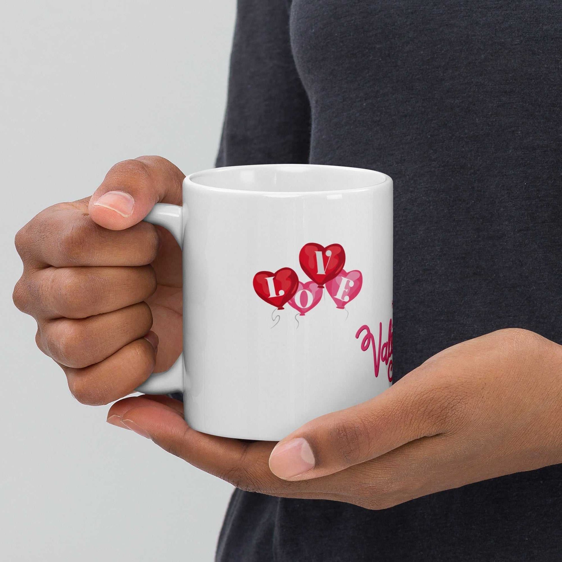Valentine Mug Ceramic with heart balloons spelling 'LOVE', 11oz mug held in hands, ideal for romantic gifts and daily use.