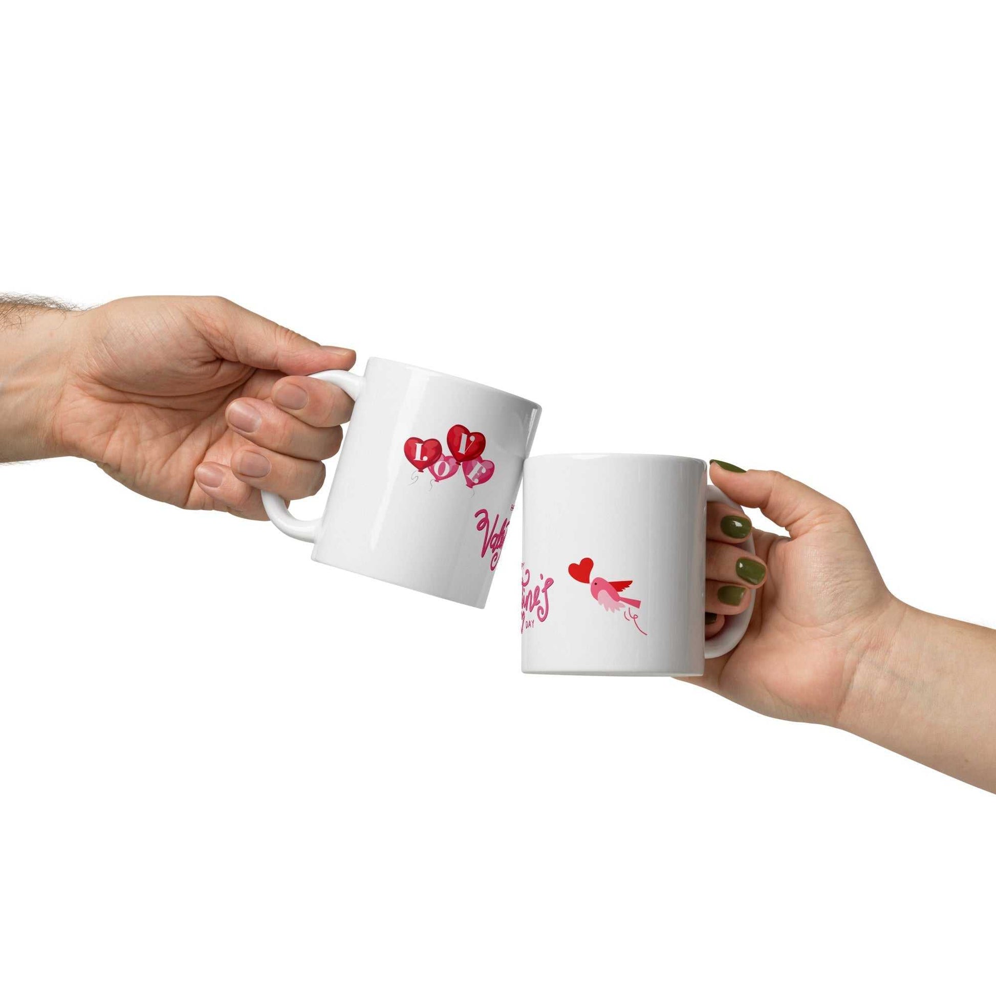 Two people clinking Valentine Mug Ceramic cups with heart balloon and bird designs, perfect for romantic gifting.