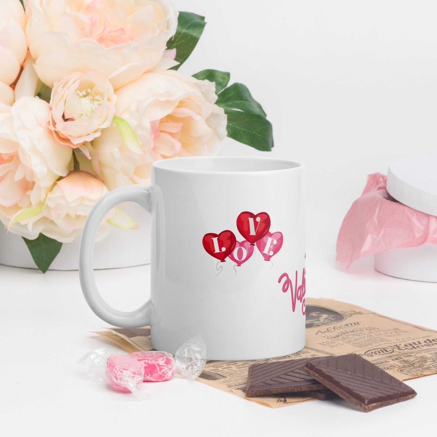 Valentine Mug Ceramic with heart balloons and 'LOVE' text, 11oz mug styled with flowers and chocolates, perfect for gifting.