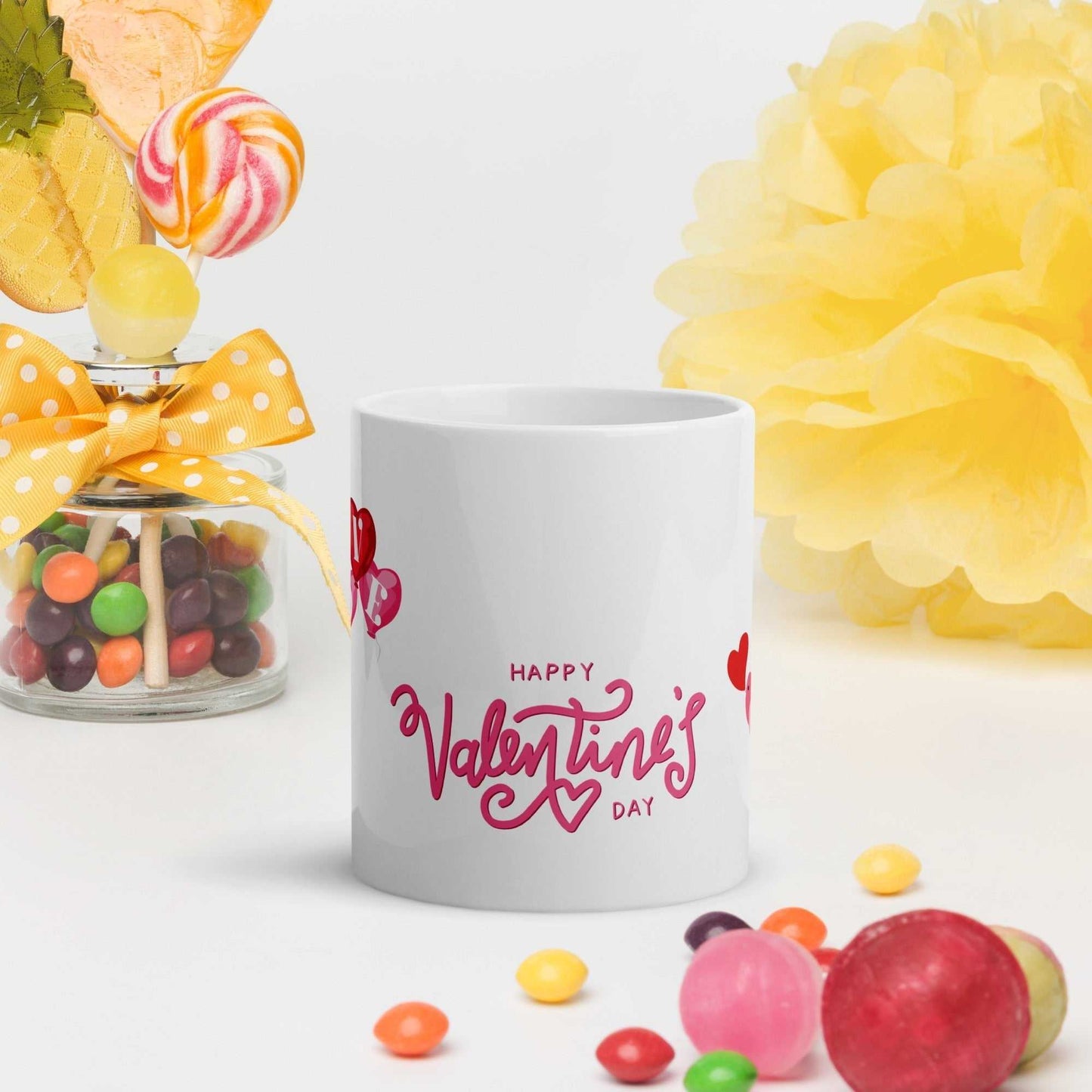 Valentine Mug Ceramic with 'Happy Valentine's Day' text, 11oz mug surrounded by candy and yellow decor, ideal for romantic gifts.