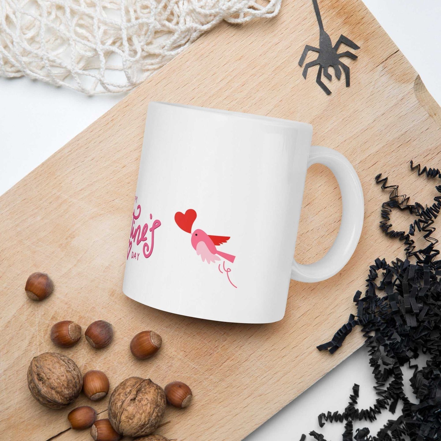 Valentine Mug Ceramic with pink bird and heart design, 11oz mug placed on wooden board, great for cozy Valentine's Day settings.