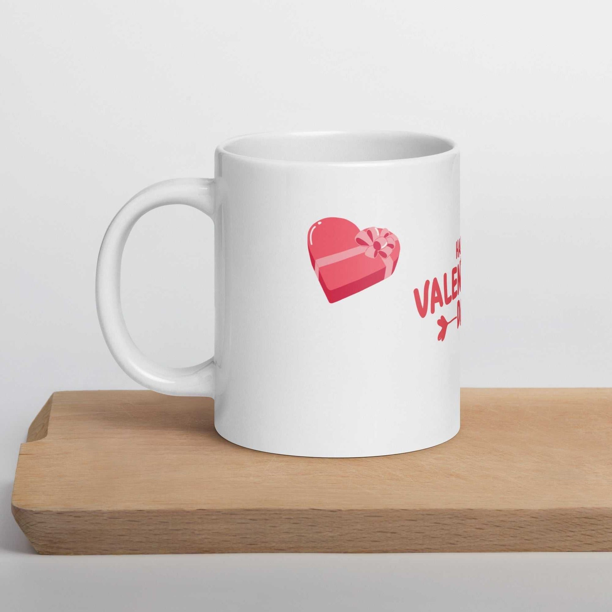 Valentine mug with heart gift box design on wooden tray. Durable ceramic for daily use.