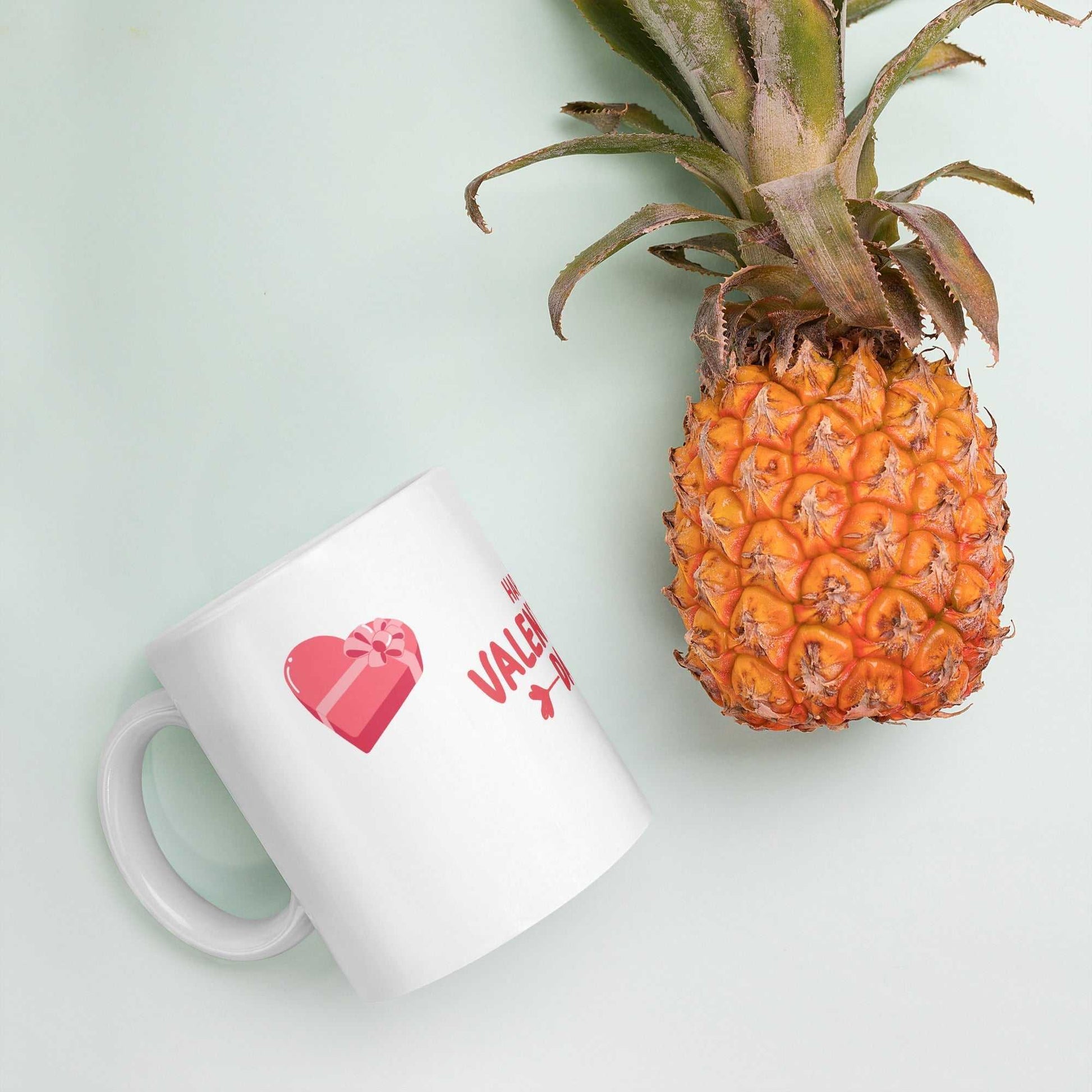 Valentine mug with heart gift box next to a pineapple. Unique kitchen and dining gift.