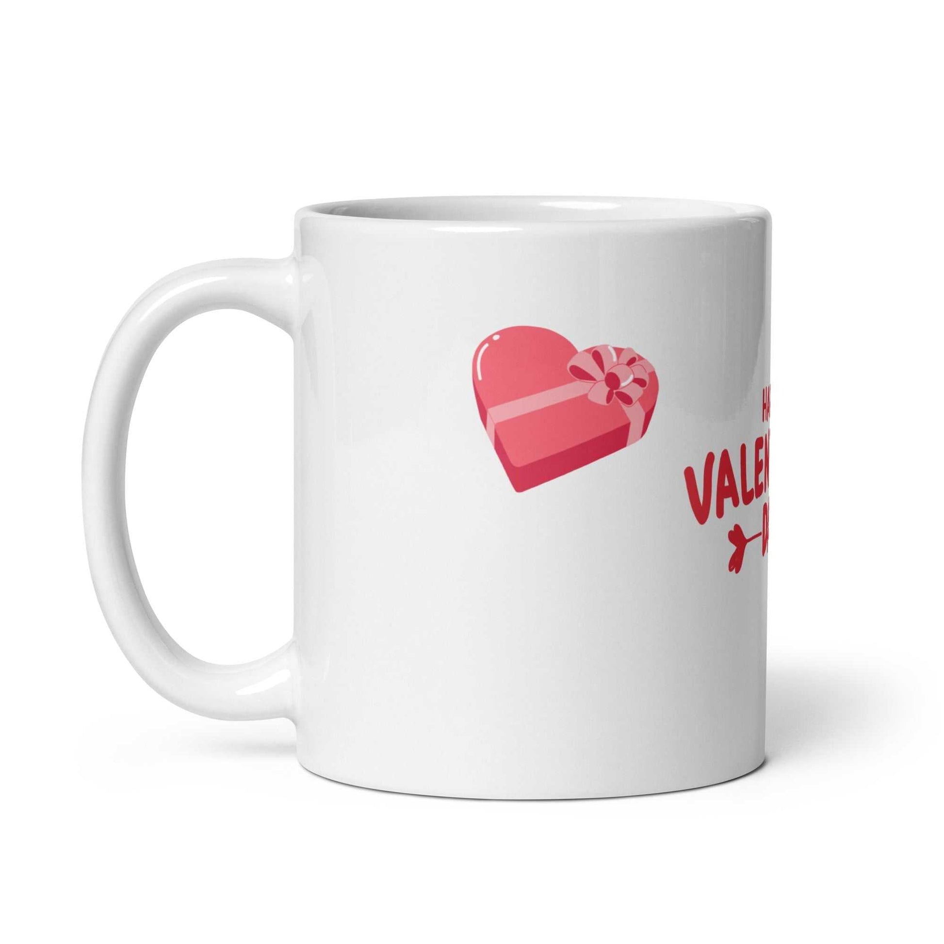 White ceramic valentine mug with pink heart-shaped gift box graphic. Great for romantic gifting.